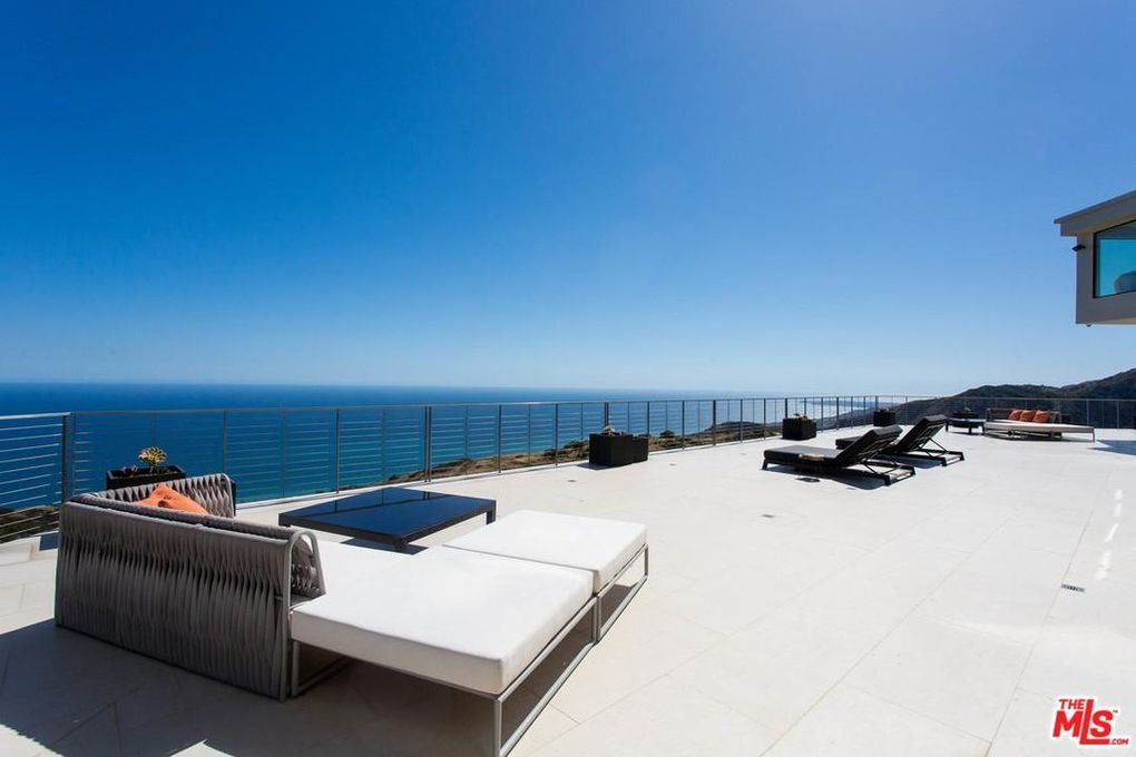 Ocean view terrace with lounge chairs