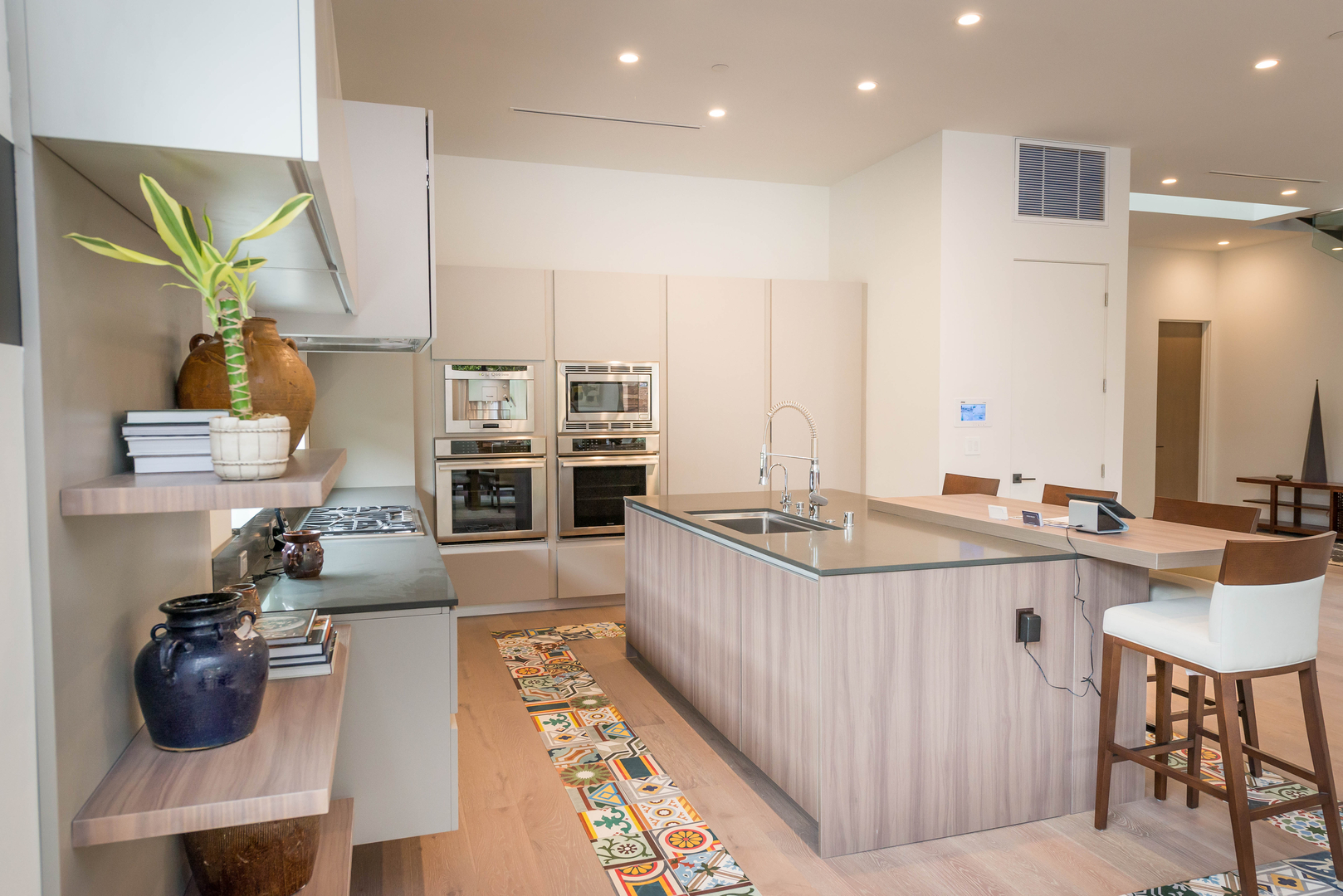 Modern kitchen interior with island and appliances.