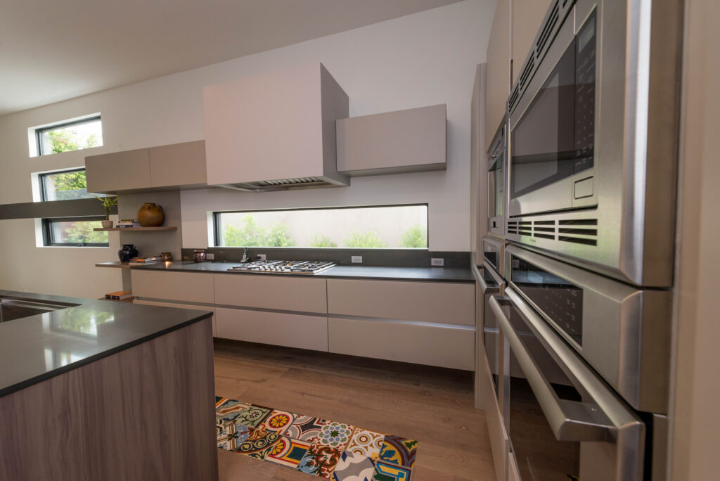 Modern kitchen interior with stainless steel appliances.