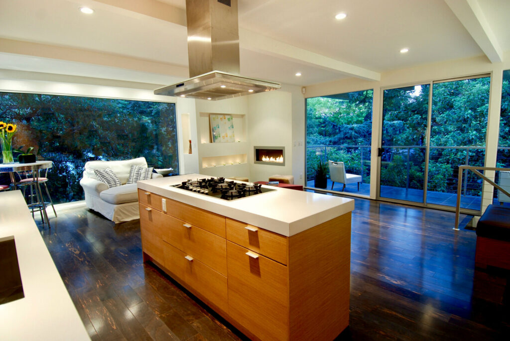 Modern kitchen with island and forest view