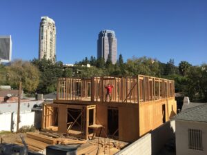 Construction site with skyscrapers in background.