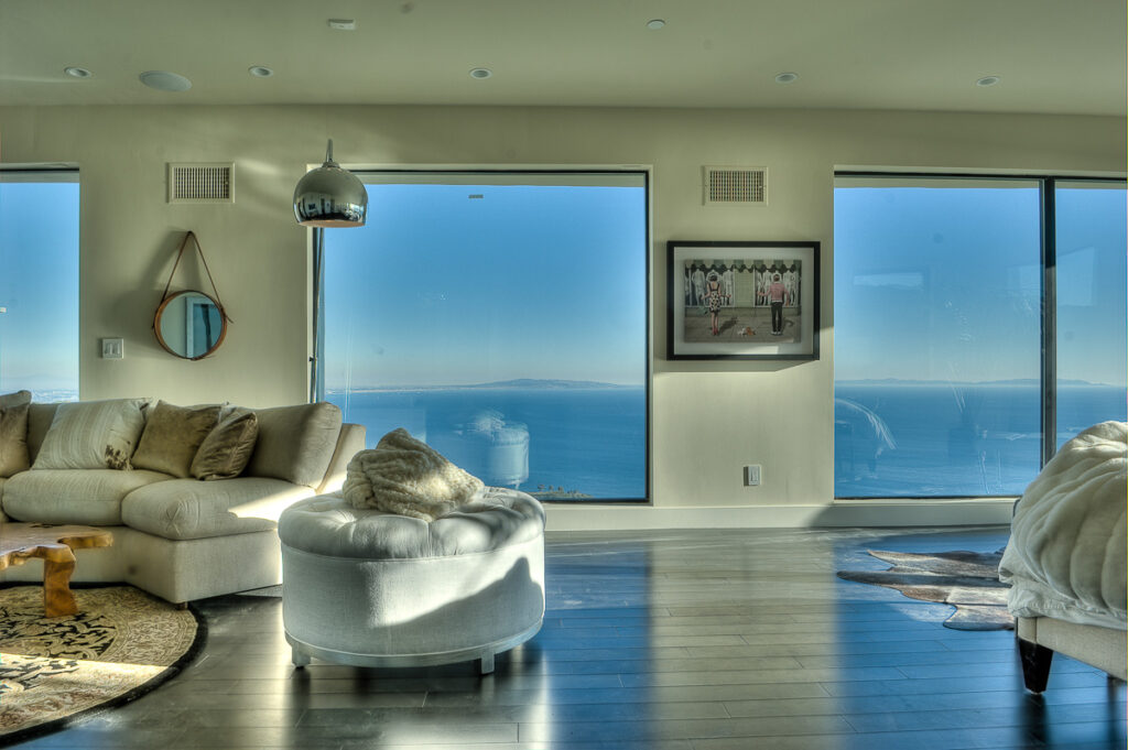 Luxurious interior with ocean view and modern furniture.