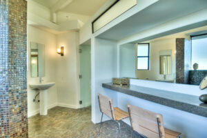 Modern bathroom with mosaic tile accent.