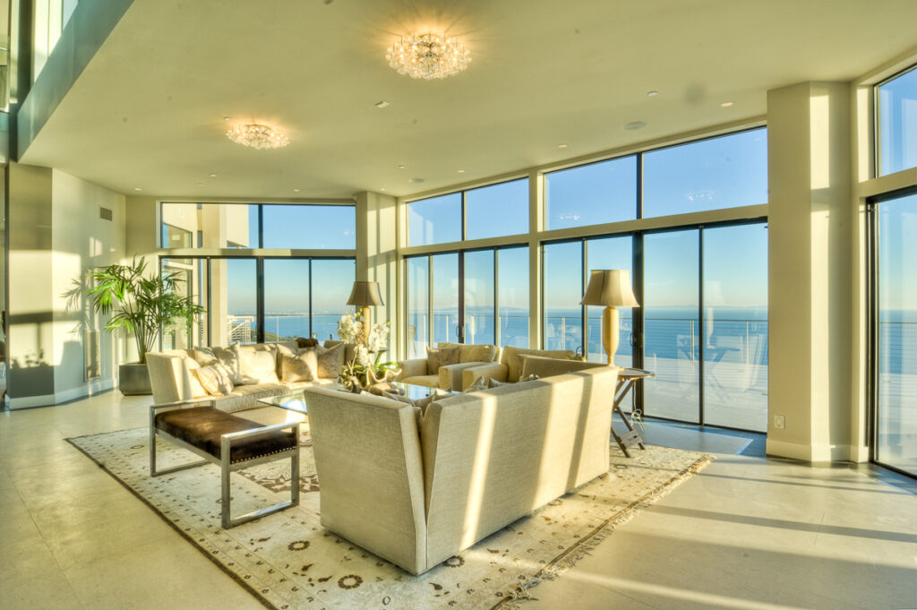 Luxurious living room with ocean view and modern decor.