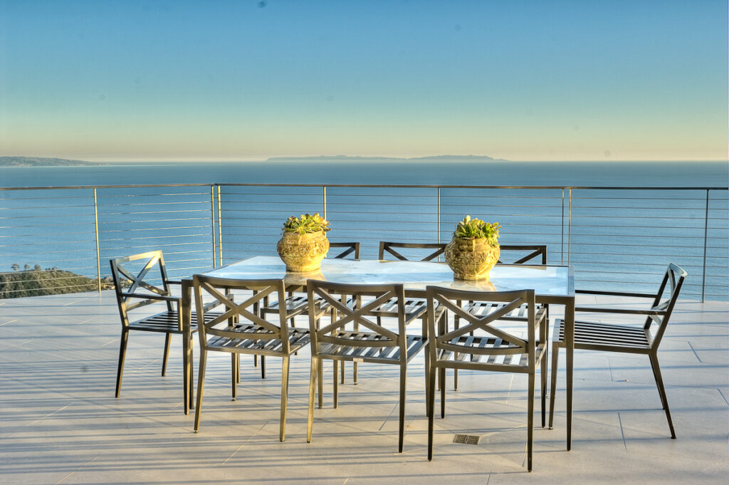 Ocean view terrace with modern outdoor furniture