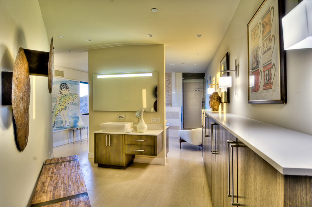Modern bathroom interior with artwork and natural light.