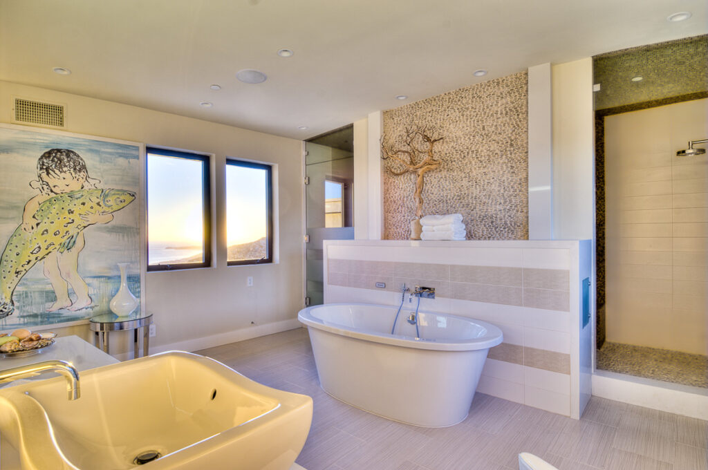 Luxurious bathroom interior with ocean view and artwork
