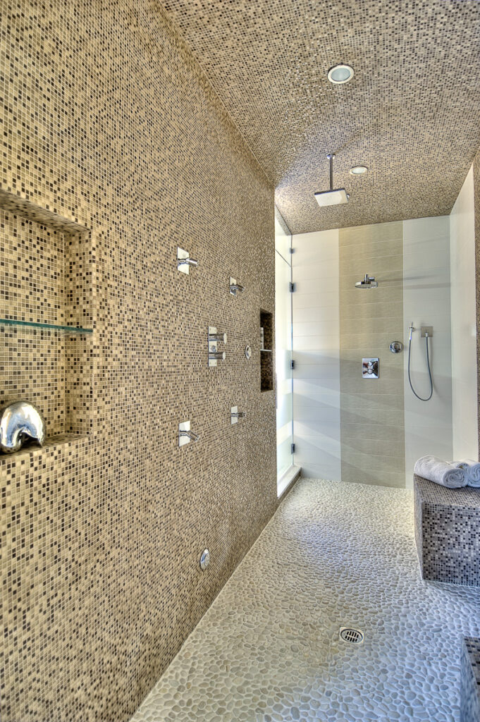 Modern tiled walk-in shower interior.