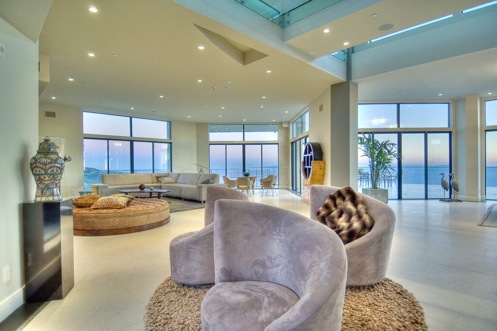 Modern spacious living room with ocean view.