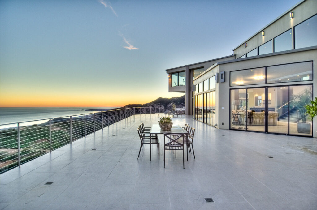 Luxury home terrace with ocean view at sunset