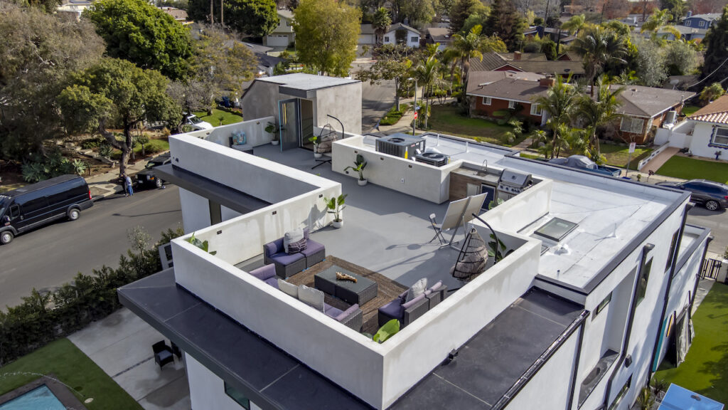 Aerial view of suburban rooftop terrace and garden.