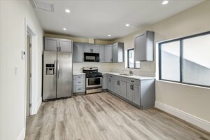 Modern kitchen with stainless steel appliances.