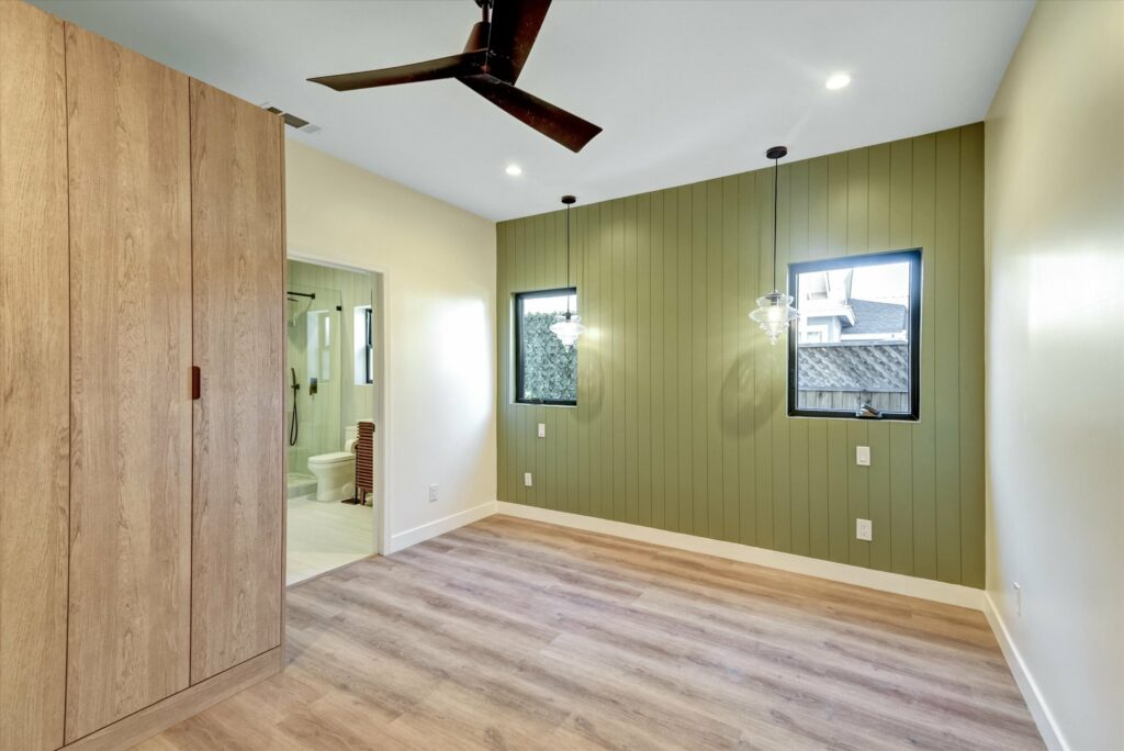 Modern empty room with wood floor and green wall