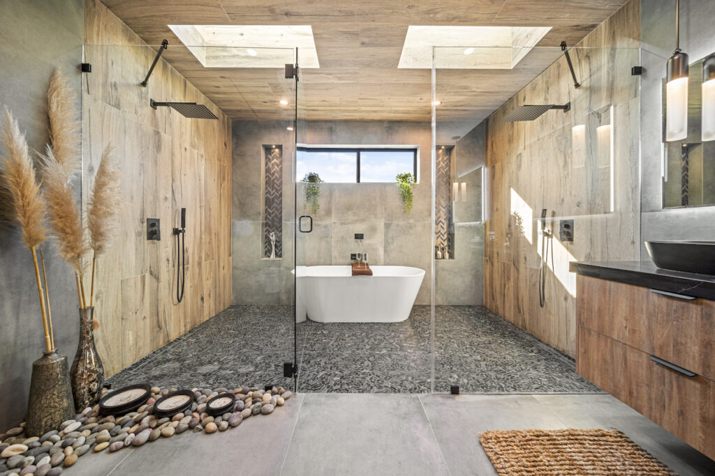 Modern bathroom with freestanding tub and walk-in shower.
