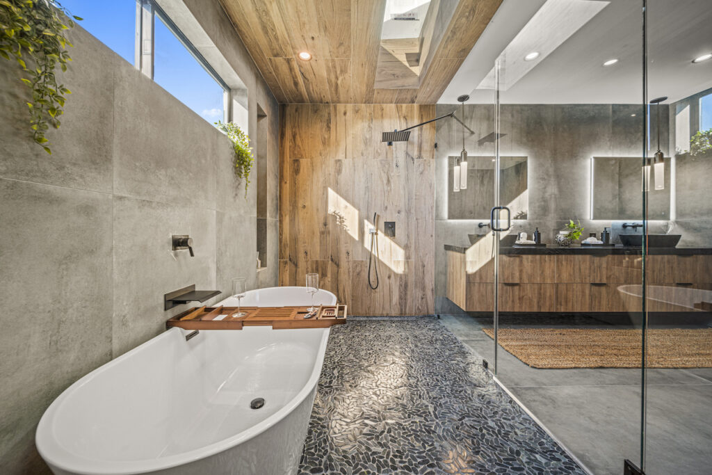 Modern bathroom with wooden accents and natural light.