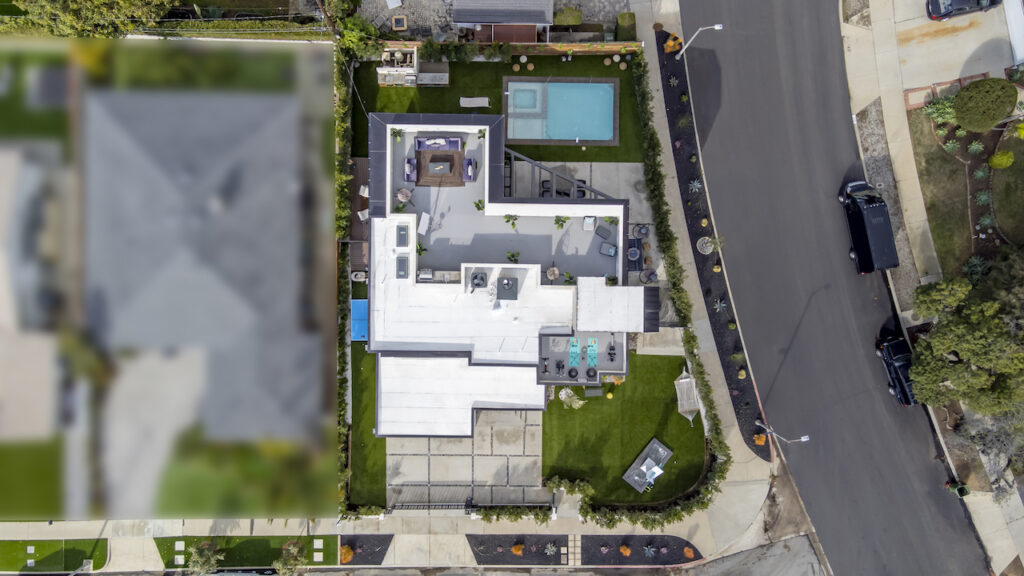 Aerial view of residential home with pool