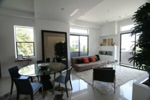 Modern living room with natural light and stylish furniture.