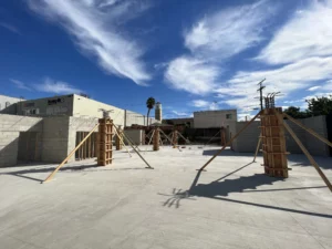 Construction site with formwork under clear blue sky