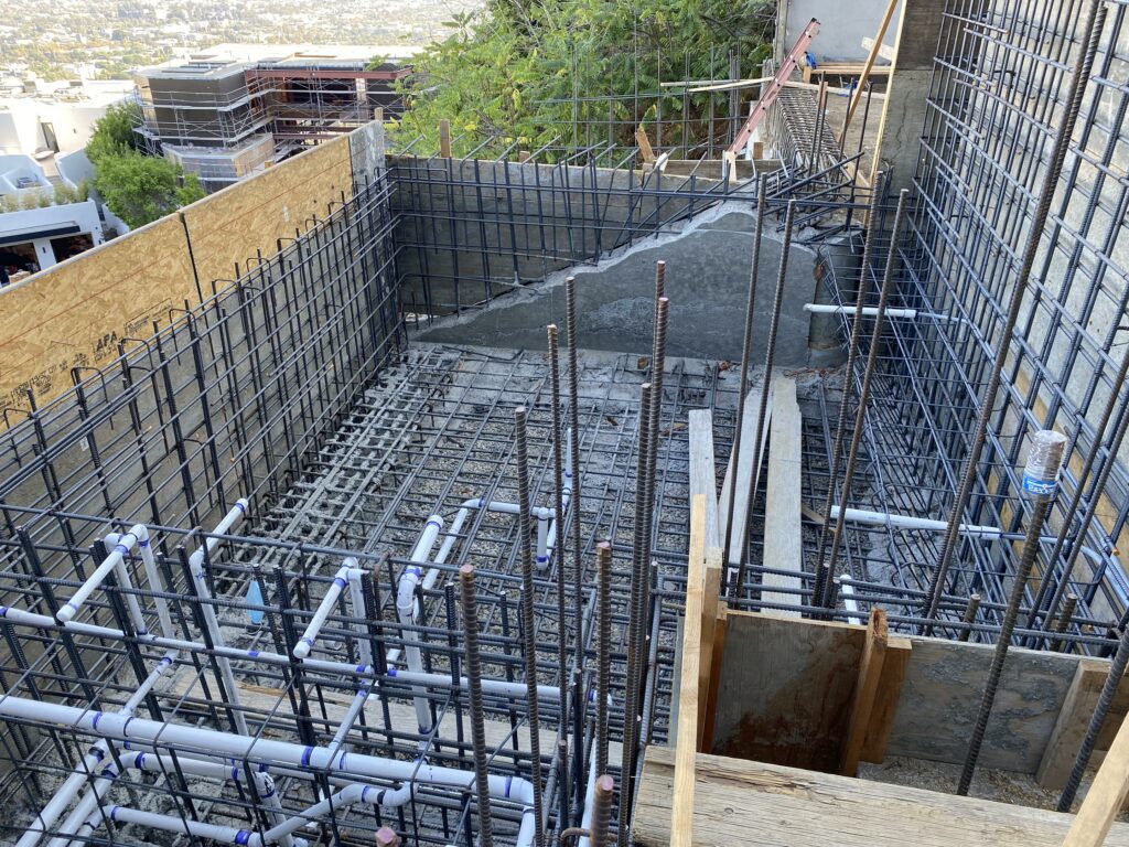 Construction site with reinforcement steel bars and formwork.