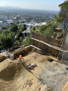 Construction site overlooking city skyline.