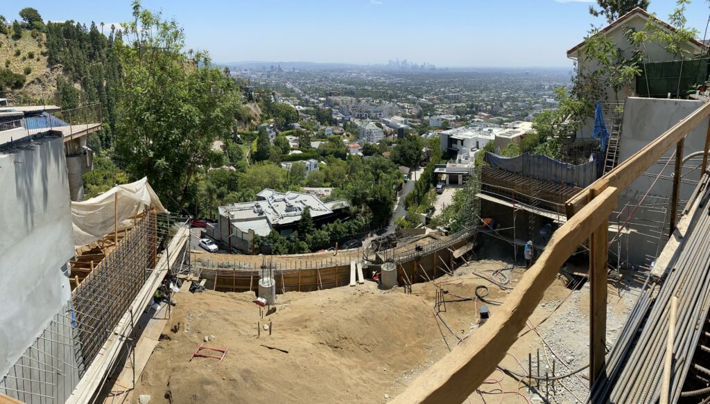 Panoramic view of city skyline from construction site.