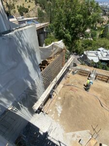 Construction site with scaffolding and workers.