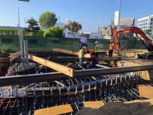 Construction workers building foundation at a construction site.