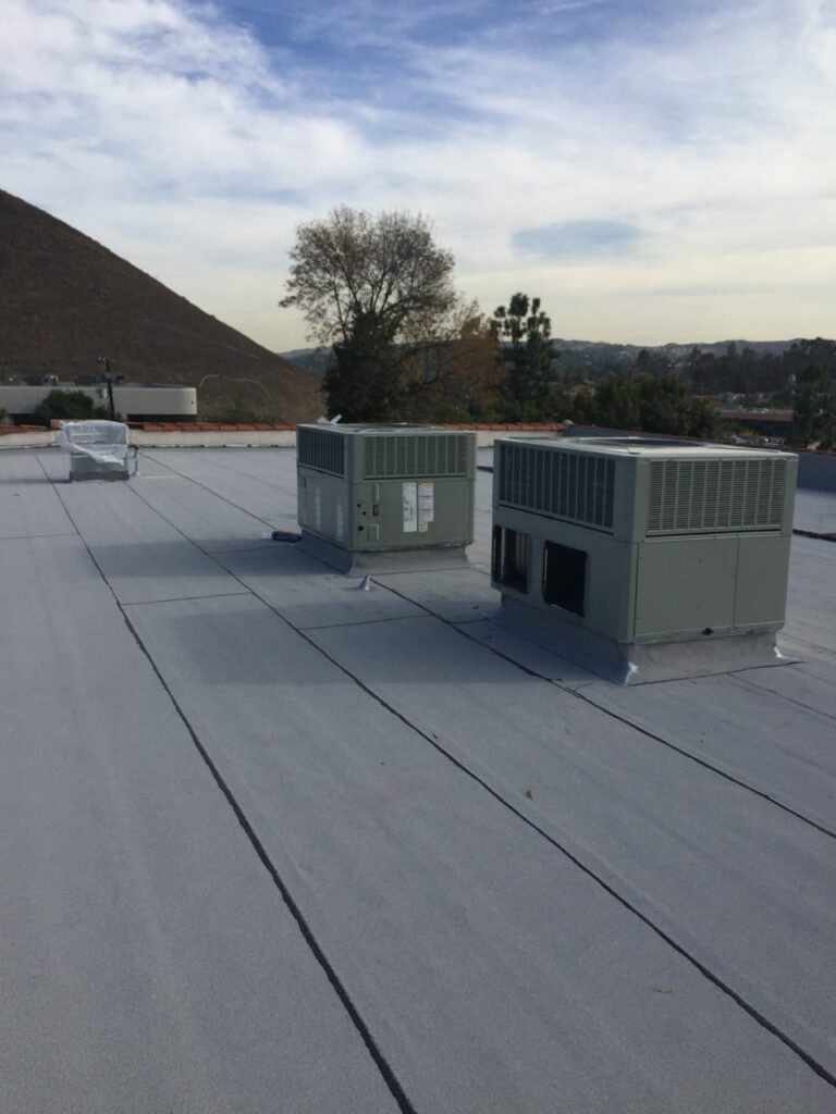 Commercial HVAC units on flat rooftop