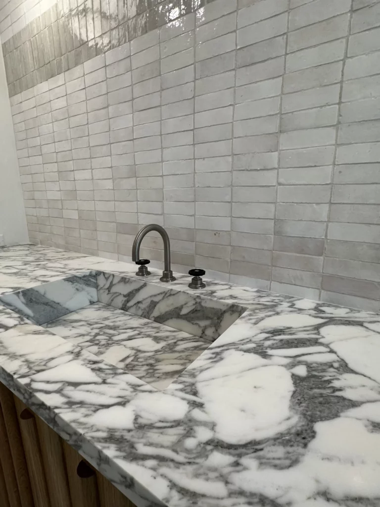 Modern marble countertop with undermount sink and faucet.