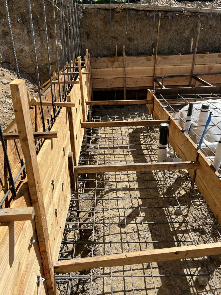 Construction foundation framework with rebar grid.