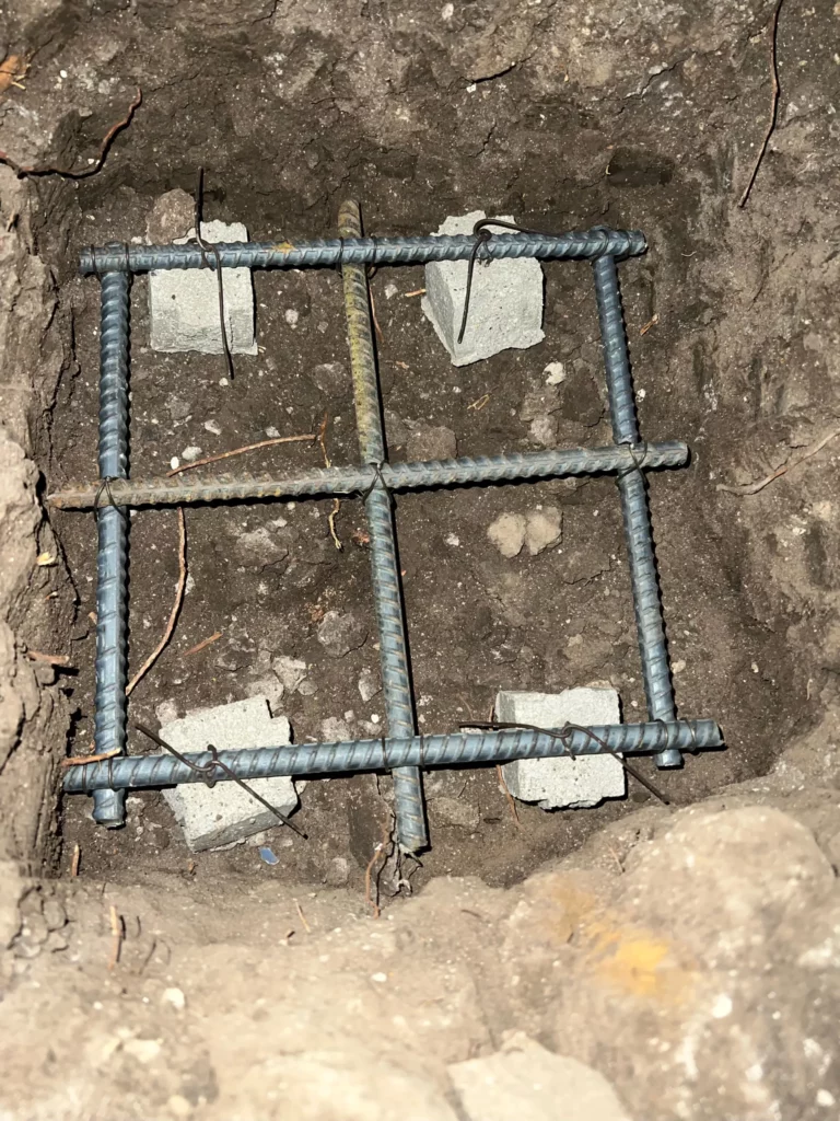 Rebar framework in foundation trench ready for concrete.
