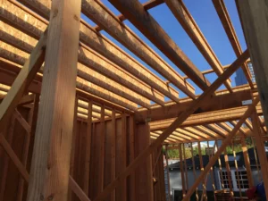 Wooden house frame construction in daylight.