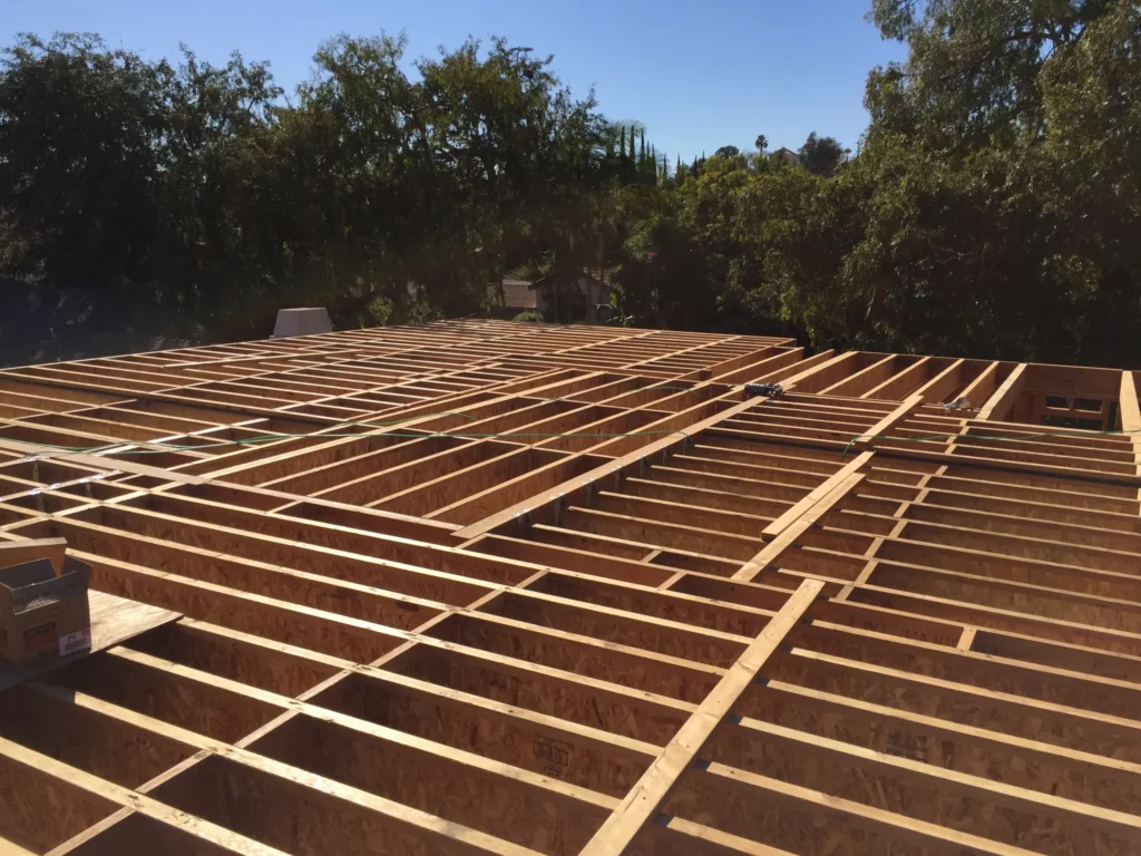 Wooden roof framework construction site.