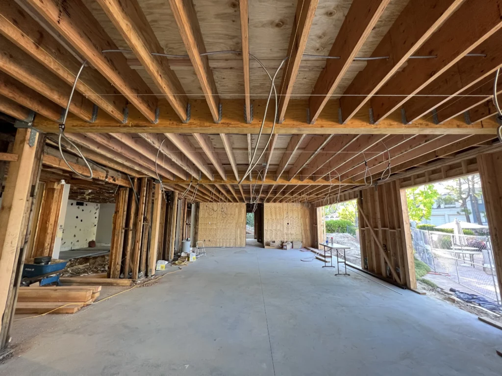 Interior construction site with exposed wooden beams