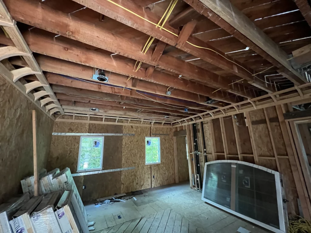 Interior construction framing and exposed ceiling beams.