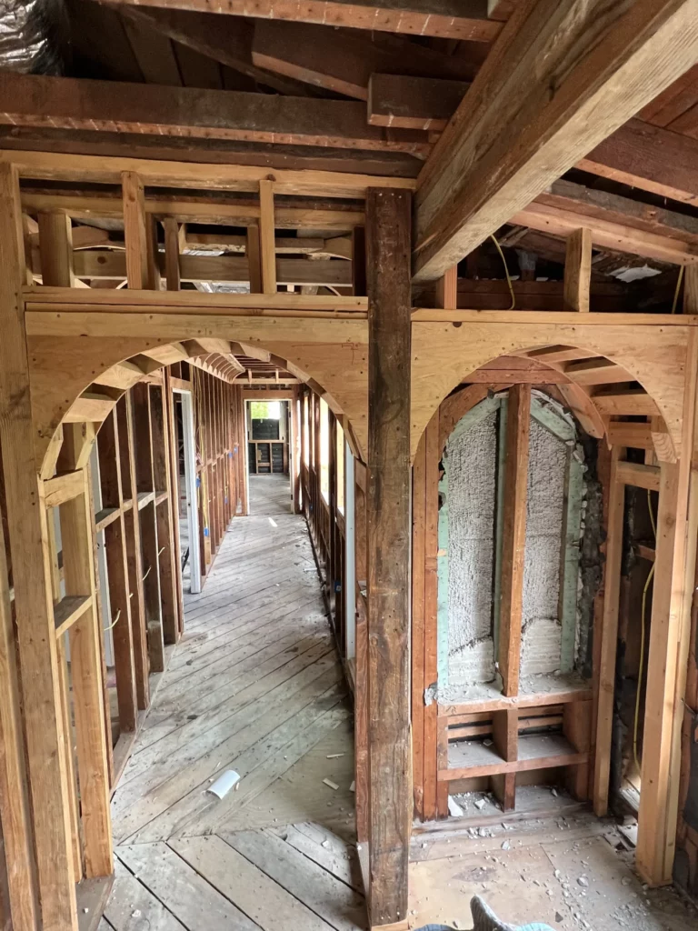 Interior view of unfinished wooden house framing.