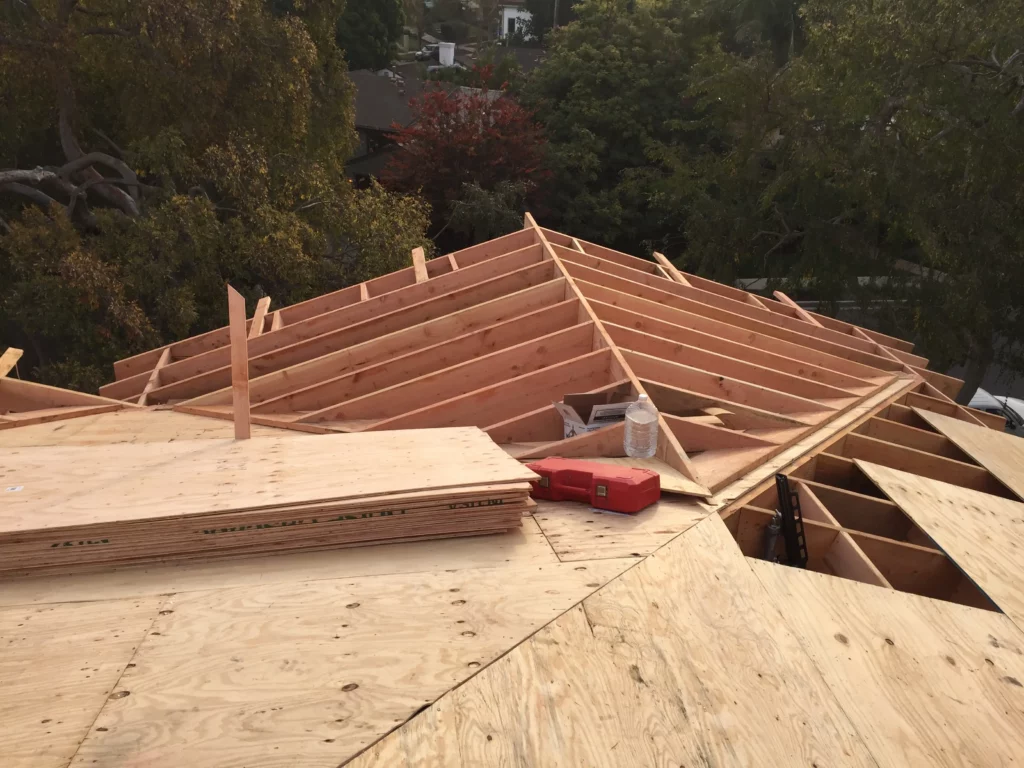 Wooden roof construction with plywood and framing