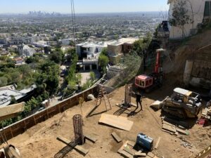 Construction site overlooking city skyline.