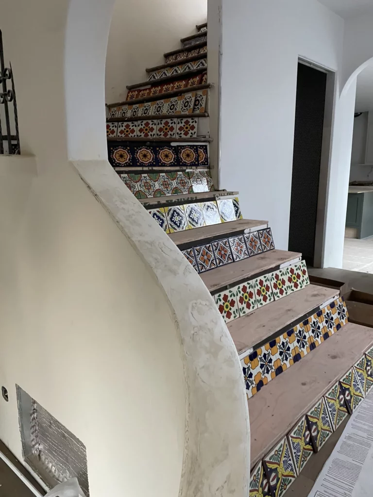 Colorful tiled staircase in modern home.