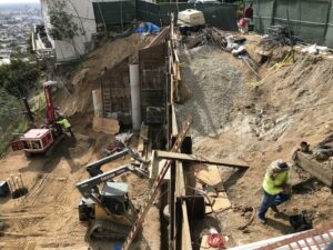 Construction site with workers and heavy machinery.