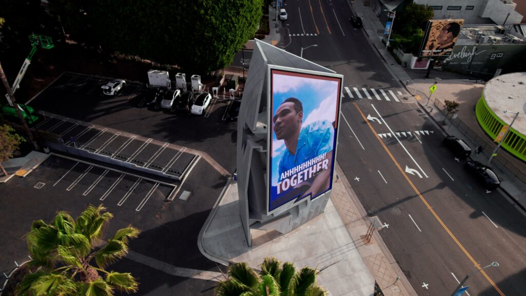Aerial view of billboard at street intersection.