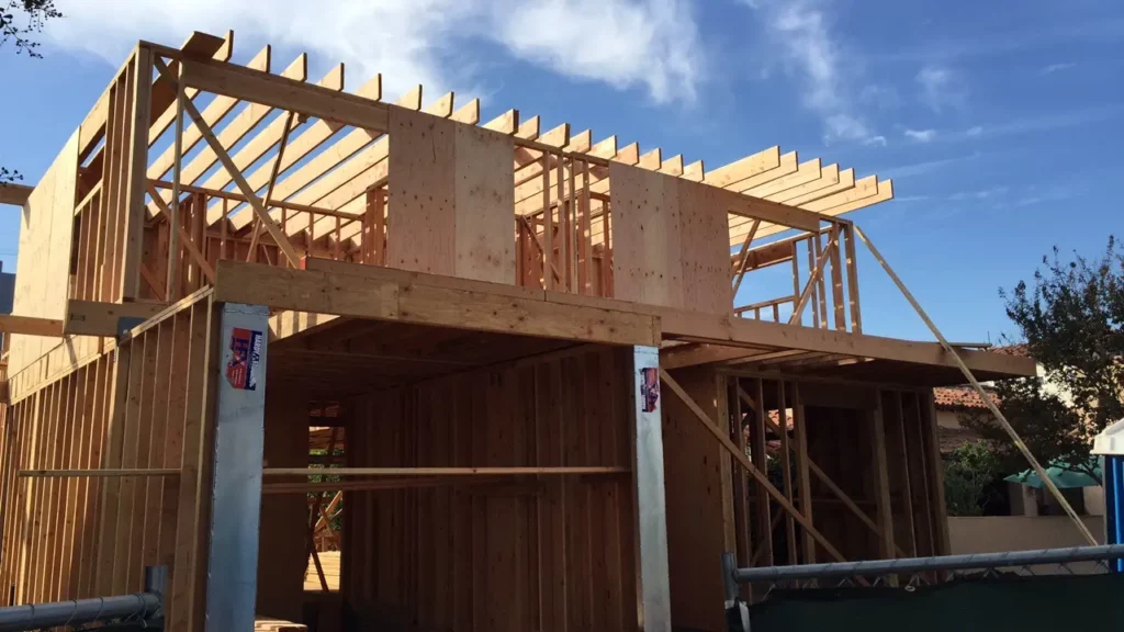Wooden house framework construction in progress