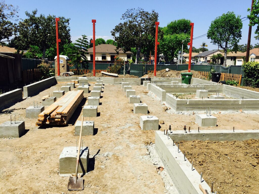 Construction site with building foundation in progress.