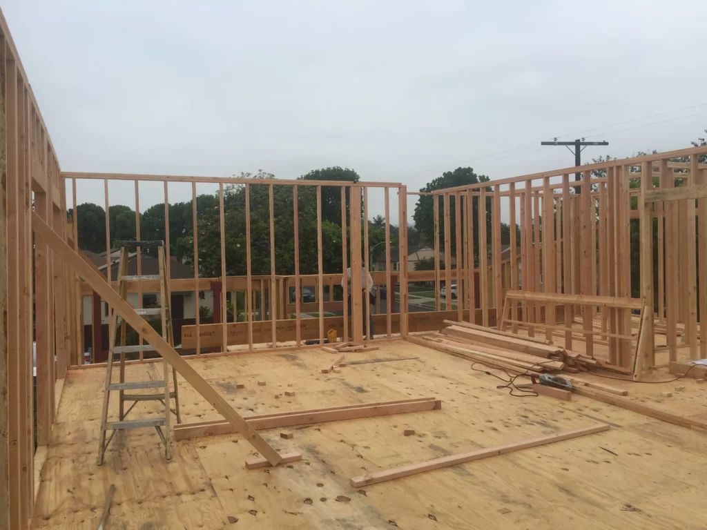 Wooden house frame construction site.