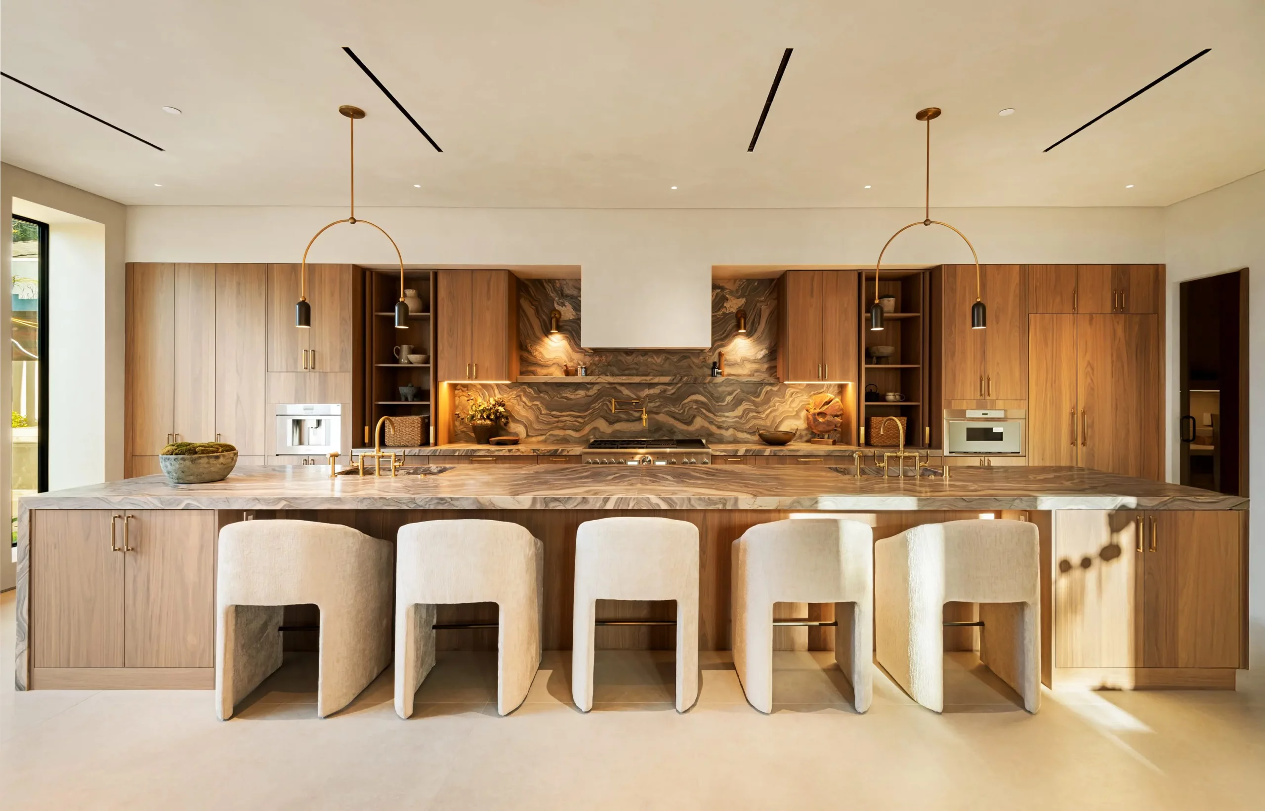 Modern kitchen with wooden cabinets and marble island