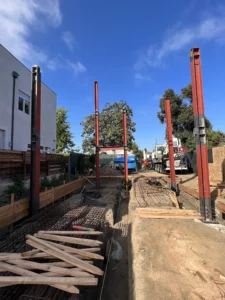 Urban construction site with steel beams and materials