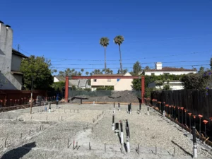 Construction site foundation with surrounded by houses