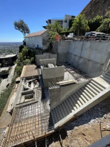 Construction site with concrete structures and city view