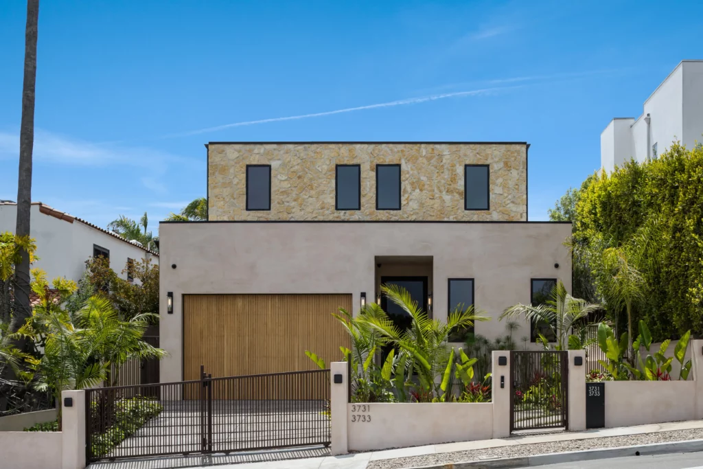 Modern house with stone upper facade and garage