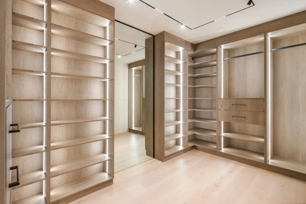 Modern empty wooden closet with integrated lighting